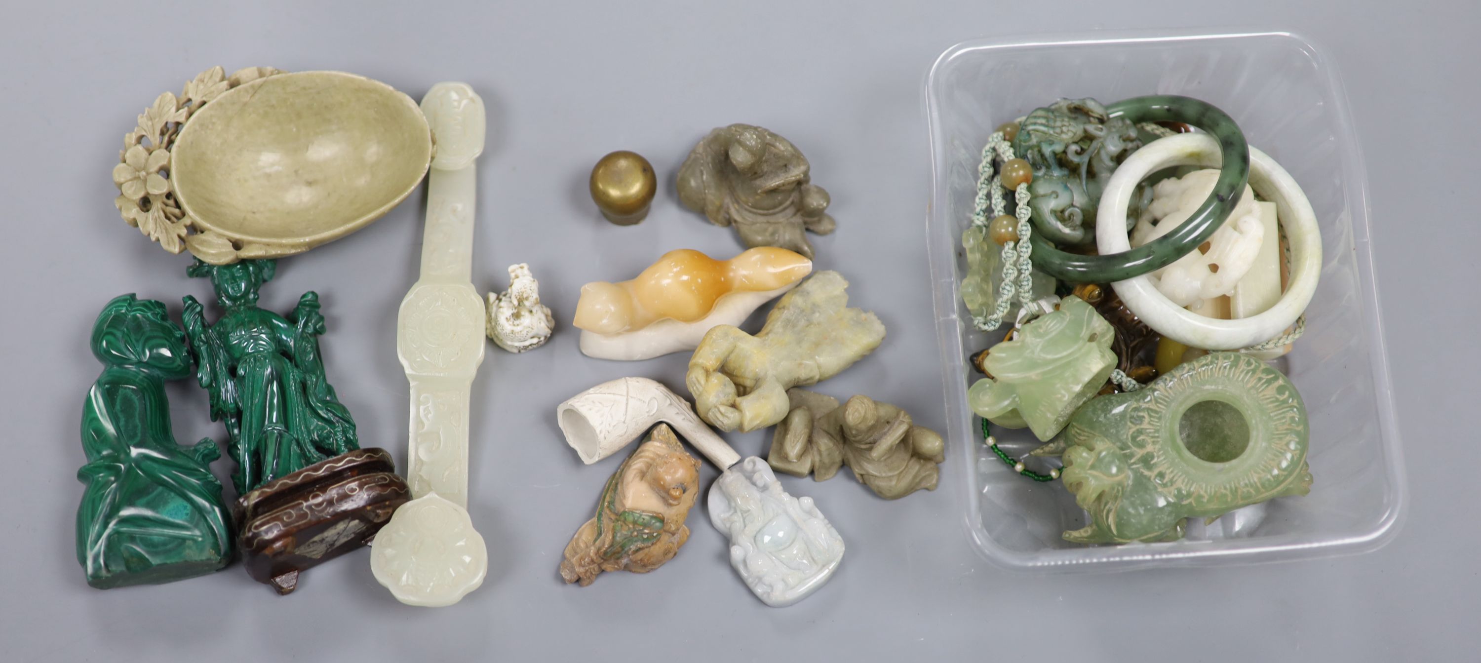 A collection of Chinese hardstone and soapstone figures, a Ruyi sceptre and various carved pendants and bangles etc